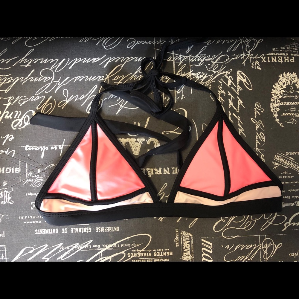Pink and black bathing suit top